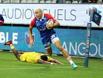 À la 35e minute, l’ailier grenoblois Karim Qadiri inscrit l’unique essai du match. Photo Jacques Robert